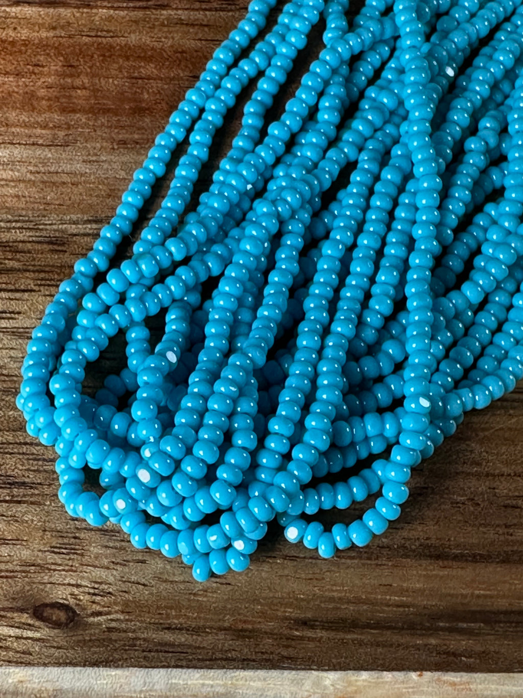 11/0 True Cut Op DK Turquoise Blue